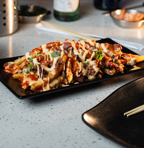 Bulgogi Fries (불고기 후라이), fries, bulgogi, cheese, gochujang aioli, spicy mayo.