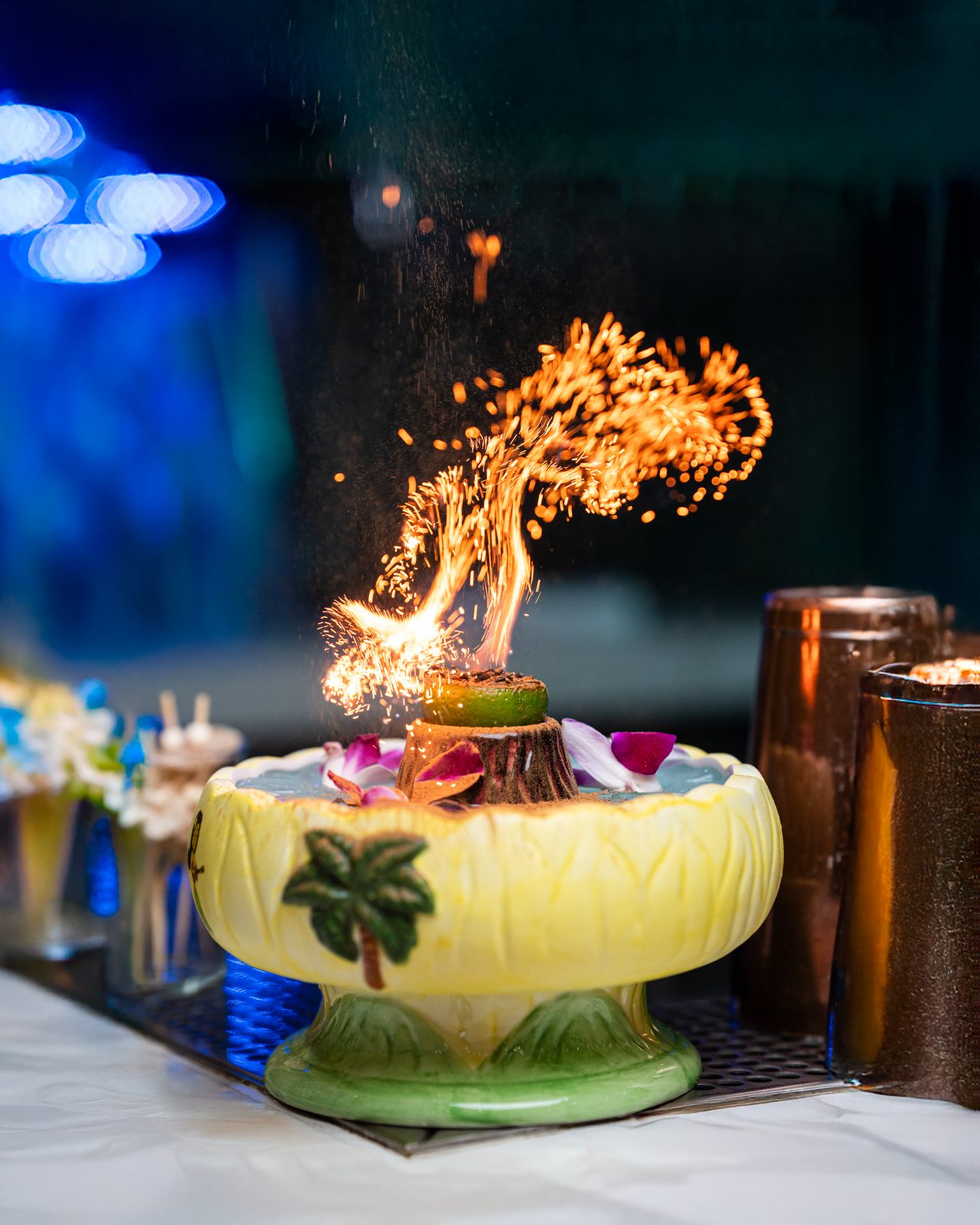 A flaming tiki cocktail being served at the West Hills bar.